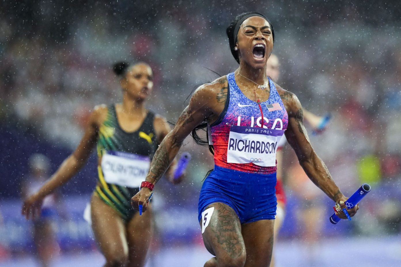 Sha'Carri Richardson chases down 2 competitors in rain to end her first